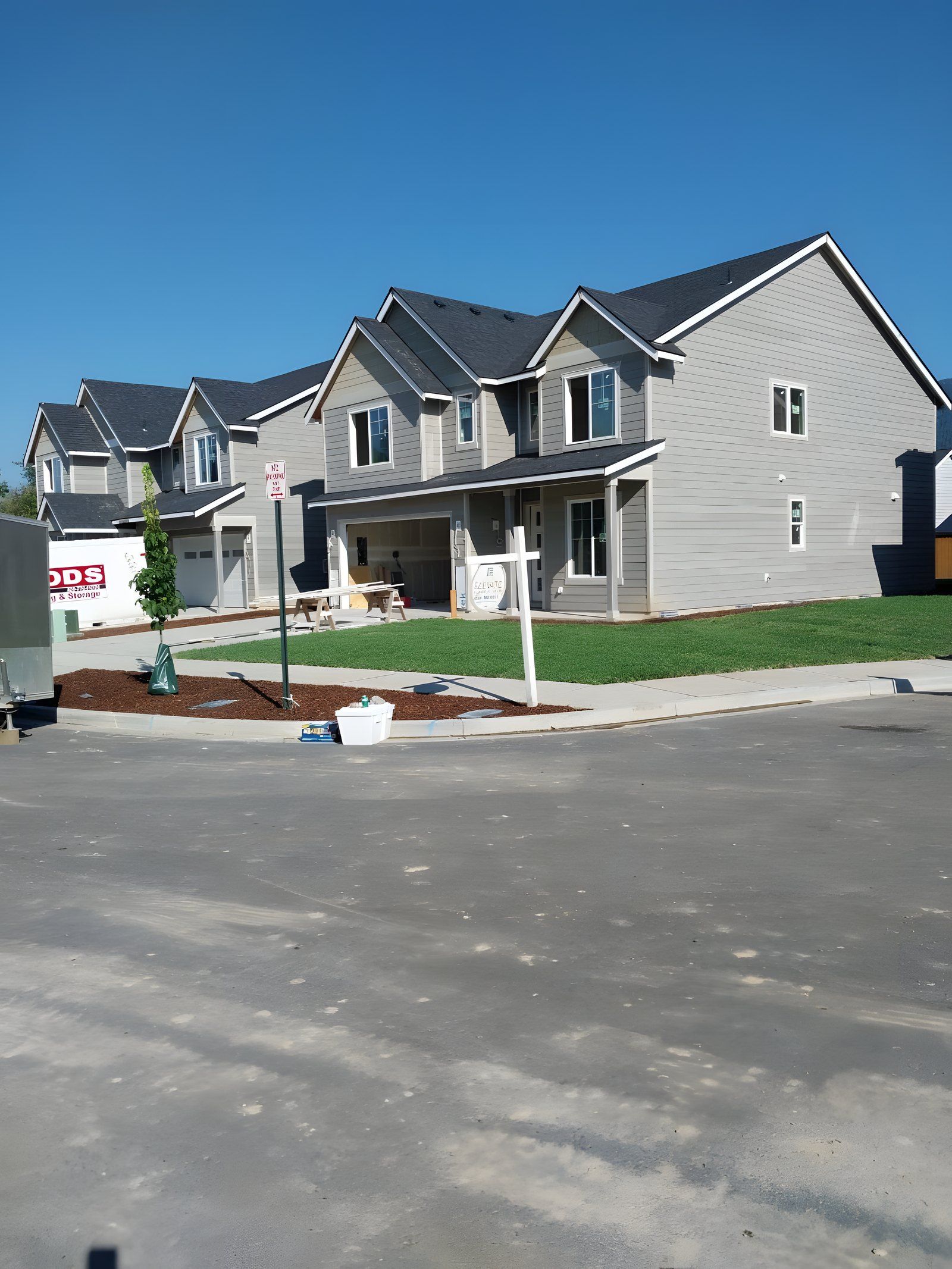 Finished front yard with sod and mulch beds at a newly built house